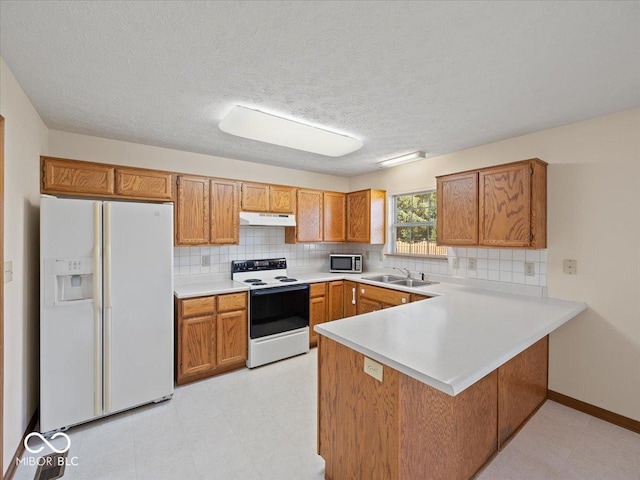 294 Keller Dr, Greenfield, IN 46140 - kitchen with white appliances, under cabinet range hood, a peninsula, light countertops, and brown cabinets