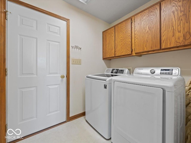 294 Keller Dr, Greenfield, IN 46140 - laundry room with cabinet space, washing machine and dryer, and light floors
