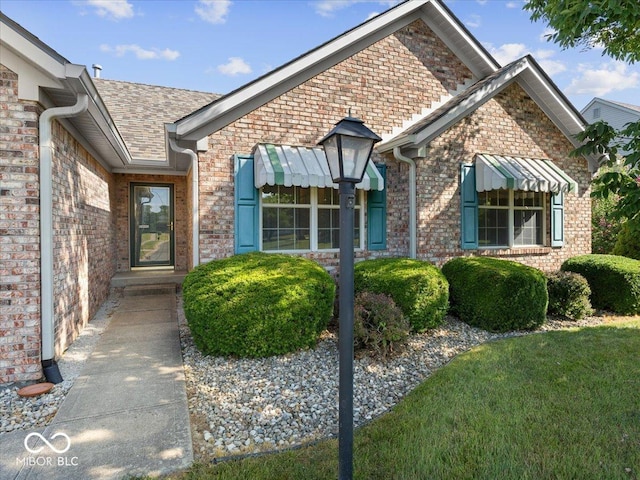 294 Keller Dr, Greenfield, IN 46140 - doorway to property with brick siding and a shingled roof