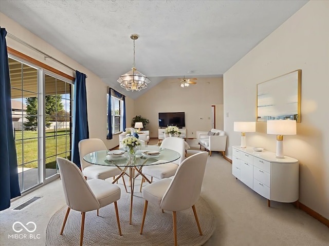 294 Keller Dr, Greenfield, IN 46140 - dining space featuring light colored carpet, a chandelier, healthy amount of natural light, and vaulted ceiling