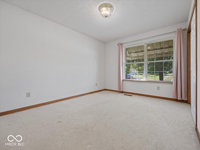 294 Keller Dr, Greenfield, IN 46140 - unfurnished room featuring light colored carpet and a textured ceiling