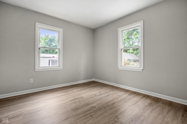 726 N Routiers Ave, Indianapolis, IN 46219 - unfurnished room featuring wood finished floors and baseboards