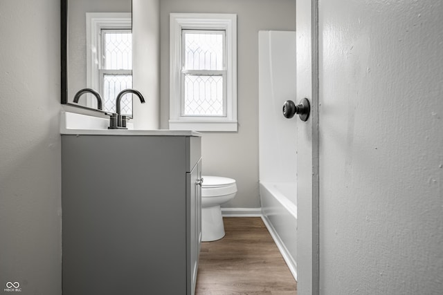 726 N Routiers Ave, Indianapolis, IN 46219 - full bathroom featuring vanity and wood finished floors