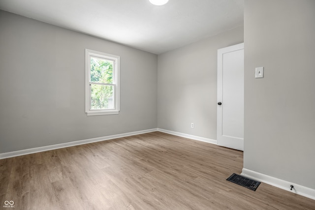726 N Routiers Ave, Indianapolis, IN 46219 - unfurnished room featuring wood finished floors and baseboards