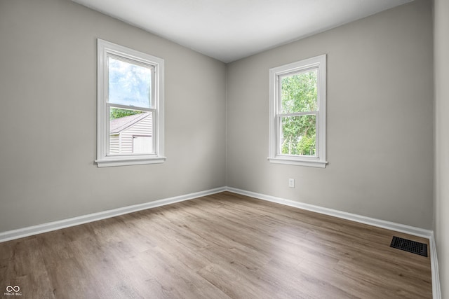 726 N Routiers Ave, Indianapolis, IN 46219 - unfurnished room featuring wood finished floors and baseboards