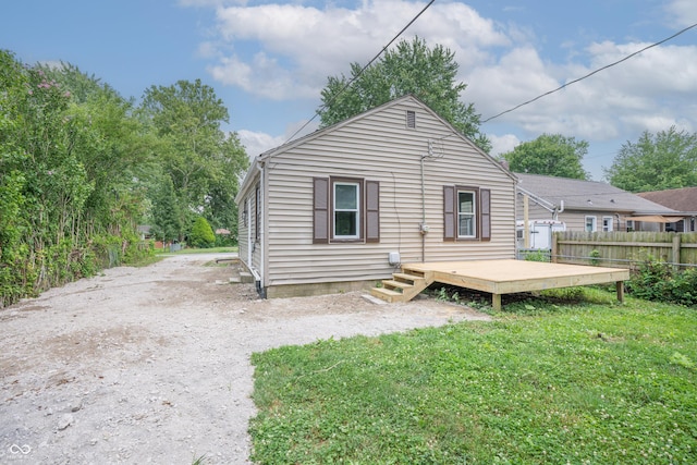 726 N Routiers Ave, Indianapolis, IN 46219 - rear view of house with a wooden deck