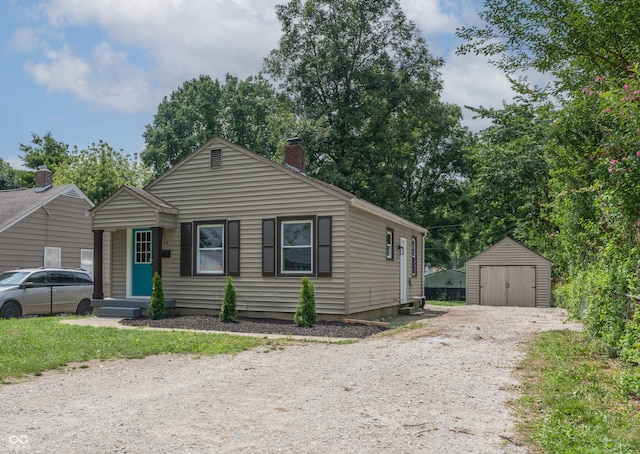 726 N Routiers Ave, Indianapolis, IN 46219 - view of front of home with a shed, a chimney, and a garage