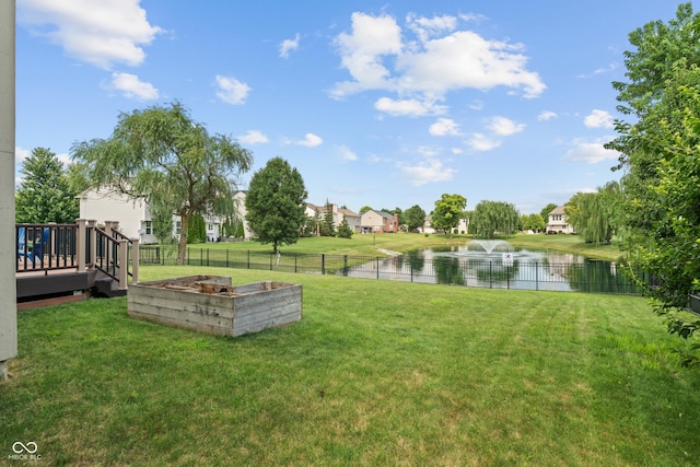 11761 Boothbay Ln, Fishers, IN 46037 - view of yard with a garden, a residential view, and a deck with water view