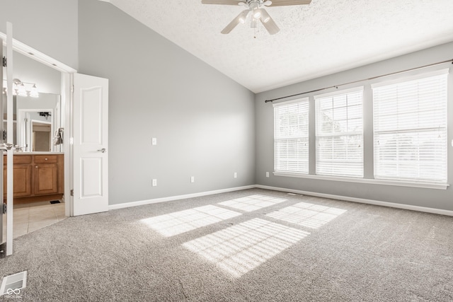 11761 Boothbay Ln, Fishers, IN 46037 - unfurnished room featuring light carpet, vaulted ceiling, a textured ceiling, and a ceiling fan