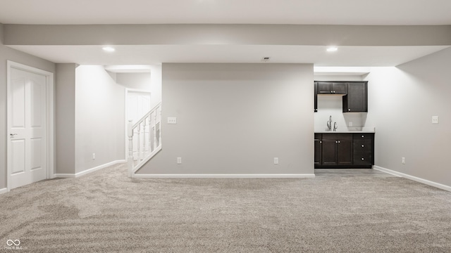 11761 Boothbay Ln, Fishers, IN 46037 - finished below grade area featuring light carpet, wet bar, stairway, and recessed lighting