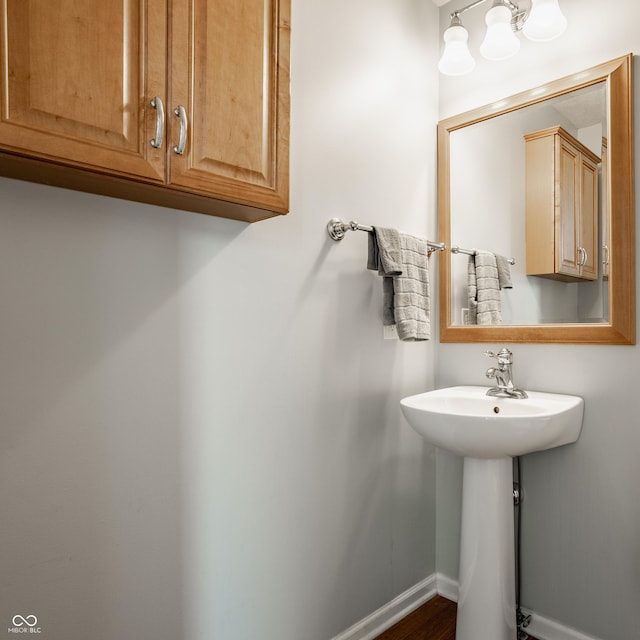 11761 Boothbay Ln, Fishers, IN 46037 - bathroom featuring baseboards and wood finished floors