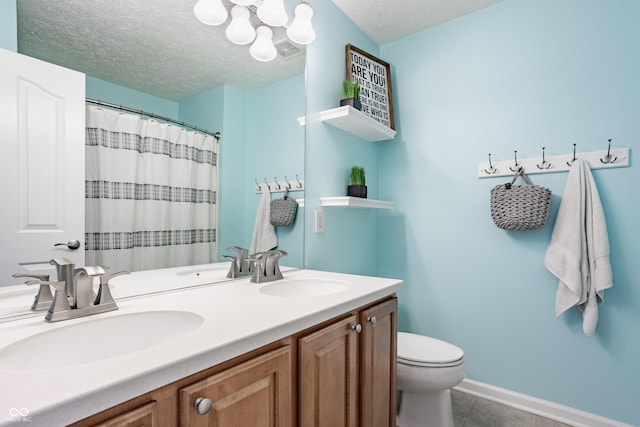 11761 Boothbay Ln, Fishers, IN 46037 - bathroom featuring double vanity, a textured ceiling, tile patterned flooring, and curtained shower