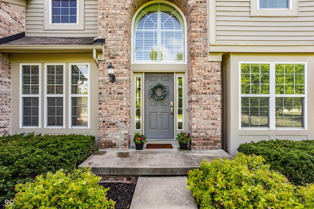 11761 Boothbay Ln, Fishers, IN 46037 - doorway to property with brick siding and a shingled roof