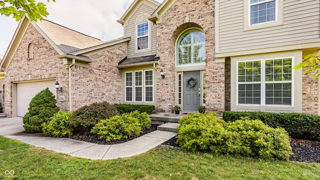 11761 Boothbay Ln, Fishers, IN 46037 - view of exterior entry featuring brick siding and an attached garage