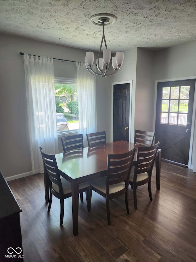 201 N Leland St, Fortville, IN 46040 - dining space featuring a chandelier, dark wood-style floors, and a textured ceiling