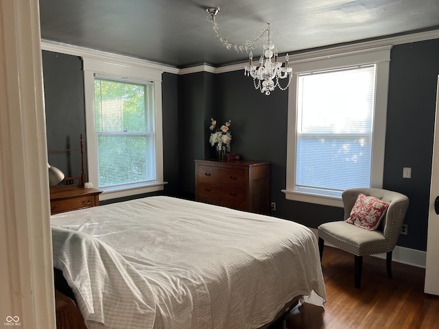 519 E Wabash Ave, Crawfordsville, IN 47933 - bedroom with a chandelier and wood finished floors