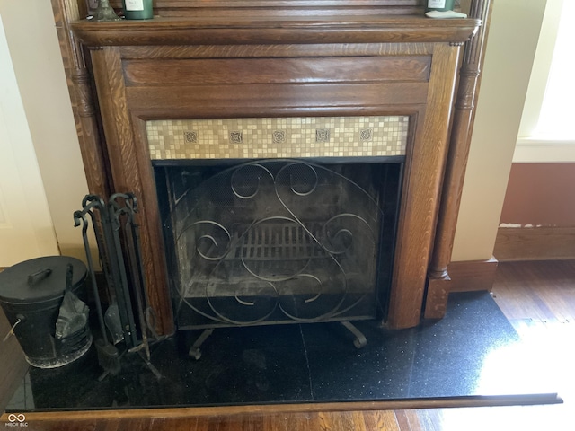 519 E Wabash Ave, Crawfordsville, IN 47933 - detailed view of a tiled fireplace and wood finished floors