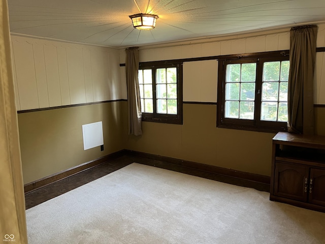 519 E Wabash Ave, Crawfordsville, IN 47933 - empty room with healthy amount of natural light and carpet flooring
