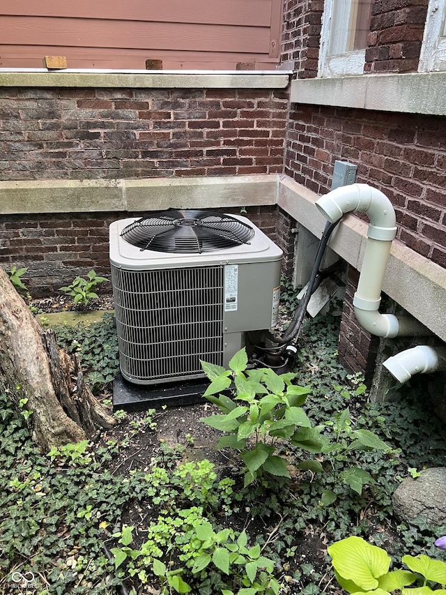 519 E Wabash Ave, Crawfordsville, IN 47933 - exterior view of a central air condition unit and brick siding