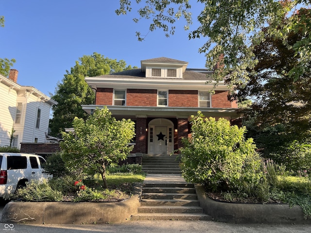 519 E Wabash Ave, Crawfordsville, IN 47933 - traditional style home with brick siding, stairway, and a porch