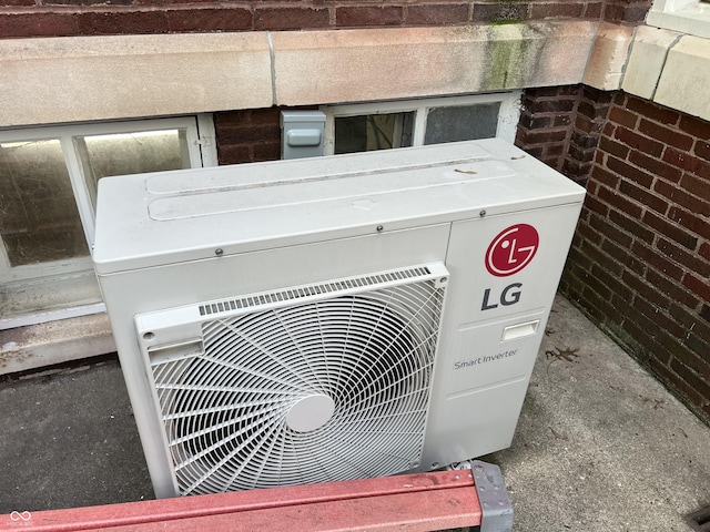 519 E Wabash Ave, Crawfordsville, IN 47933 - exterior view of an ac unit and brick siding