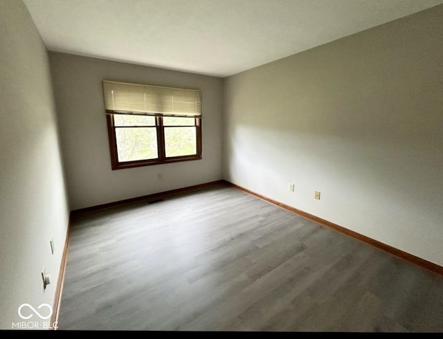 2068 Suda Dr, Carmel, IN 46280 - spare room featuring wood finished floors and baseboards
