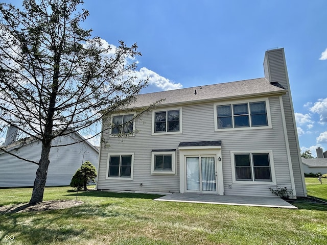 2068 Suda Dr, Carmel, IN 46280 - rear view of property featuring a patio area, a lawn, and a chimney