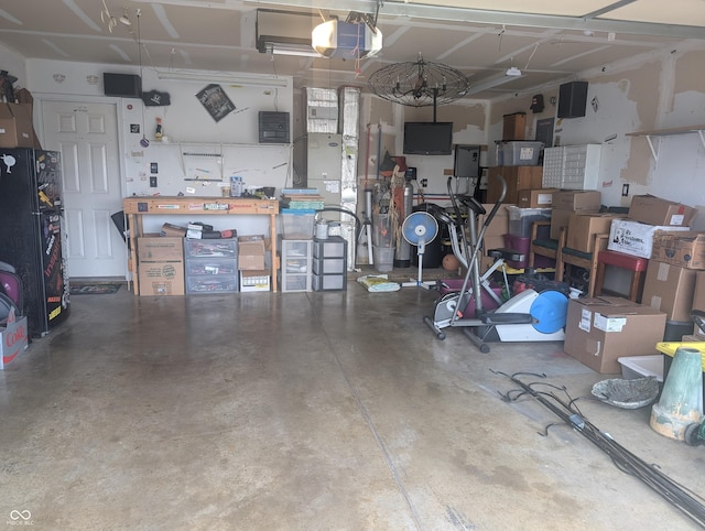 4124 Lofton Dr, Lafayette, IN 47909 - garage with a garage door opener and a workshop area