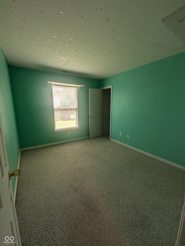 4124 Lofton Dr, Lafayette, IN 47909 - unfurnished bedroom with carpet floors and a textured ceiling