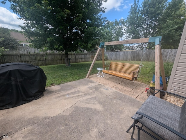 4124 Lofton Dr, Lafayette, IN 47909 - fenced backyard featuring grilling area and a patio
