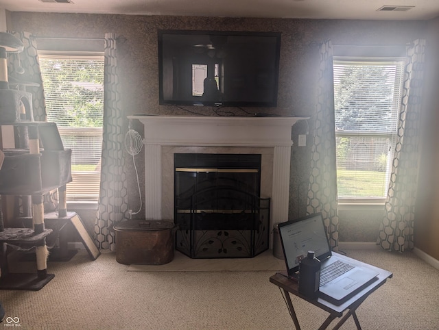 4124 Lofton Dr, Lafayette, IN 47909 - living area featuring carpet floors, a glass covered fireplace, and healthy amount of natural light