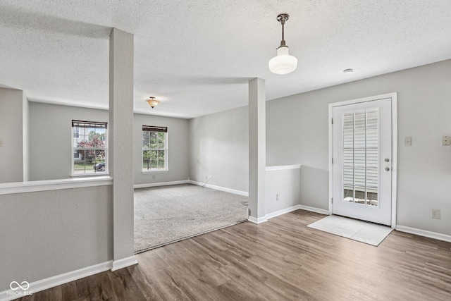 12632 Endurance Dr, Fishers, IN 46037 - unfurnished dining area with wood finished floors and a textured ceiling