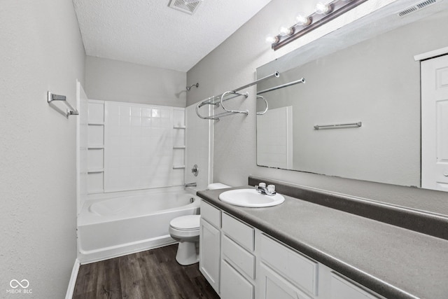 12632 Endurance Dr, Fishers, IN 46037 - full bathroom with wood finished floors, vanity, tub / shower combination, and a textured ceiling
