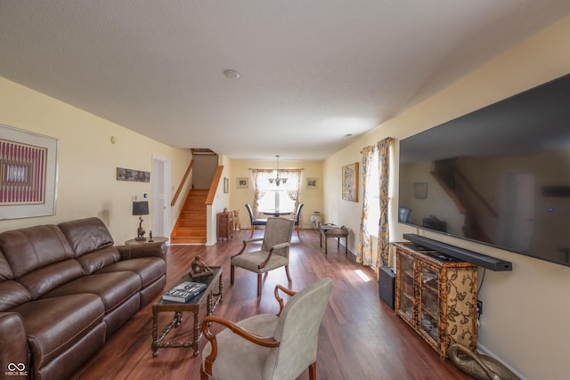 10301 Cerulean Dr, Noblesville, IN 46060 - living area featuring stairway, a chandelier, and dark wood-style floors