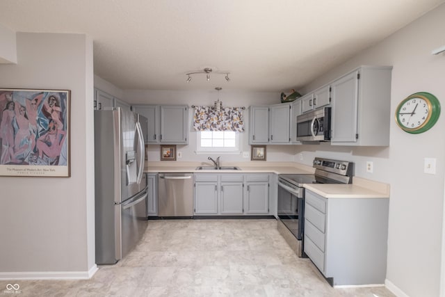 10301 Cerulean Dr, Noblesville, IN 46060 - kitchen with stainless steel appliances, light countertops, and gray cabinets