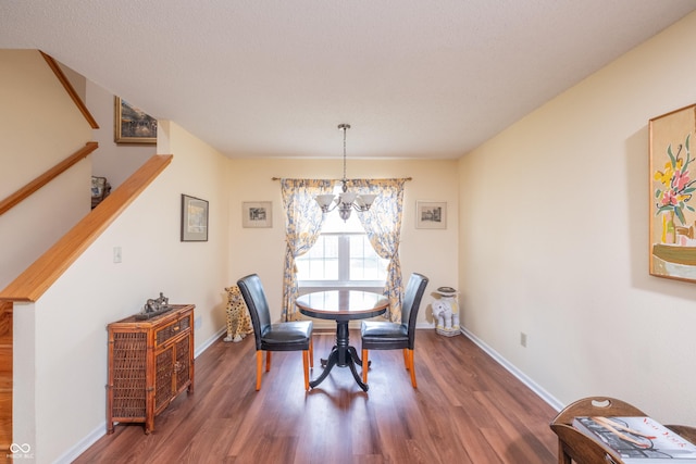 10301 Cerulean Dr, Noblesville, IN 46060 - dining space with wood finished floors, a chandelier, and stairs