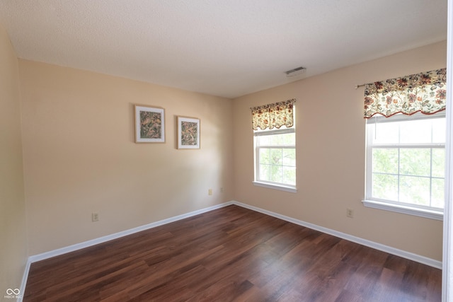 10301 Cerulean Dr, Noblesville, IN 46060 - spare room featuring dark wood-style flooring and baseboards