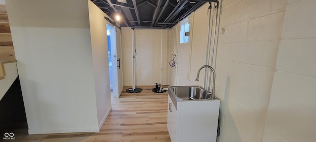2611 Taylor Rd, Columbus, IN 47203 - kitchen featuring light wood-type flooring and concrete block wall