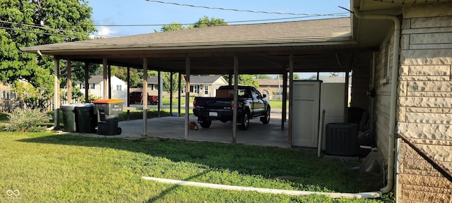 2611 Taylor Rd, Columbus, IN 47203 - view of parking with a carport