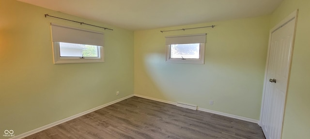 2611 Taylor Rd, Columbus, IN 47203 - spare room featuring healthy amount of natural light and wood finished floors