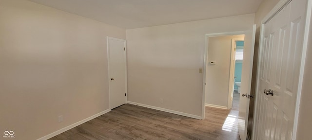2611 Taylor Rd, Columbus, IN 47203 - unfurnished room with wood finished floors and baseboards