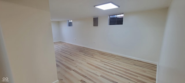 2611 Taylor Rd, Columbus, IN 47203 - basement featuring light wood-type flooring, healthy amount of natural light, and electric panel