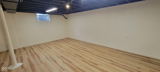 2611 Taylor Rd, Columbus, IN 47203 - basement with wood finished floors and baseboards