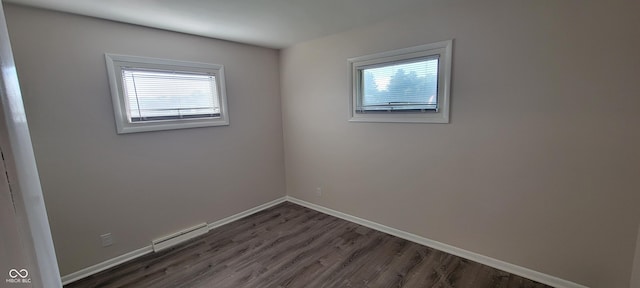 2611 Taylor Rd, Columbus, IN 47203 - spare room featuring healthy amount of natural light and dark wood-style floors