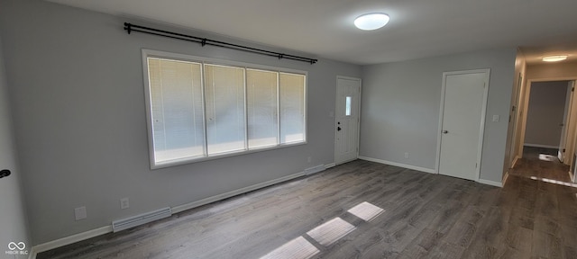 2611 Taylor Rd, Columbus, IN 47203 - unfurnished room with wood finished floors and baseboards