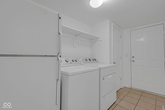 8850 Tanner Dr, Fishers, IN 46038 - laundry area featuring independent washer and dryer and light tile patterned floors