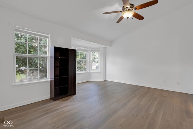 8850 Tanner Dr, Fishers, IN 46038 - unfurnished living room featuring a ceiling fan, wood finished floors, and vaulted ceiling
