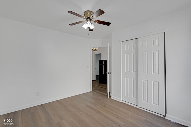 8850 Tanner Dr, Fishers, IN 46038 - unfurnished bedroom with wood finished floors, a closet, and ceiling fan
