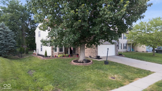 8850 Tanner Dr, Fishers, IN 46038 - view of property hidden behind natural elements with concrete driveway, a front yard, and an attached garage