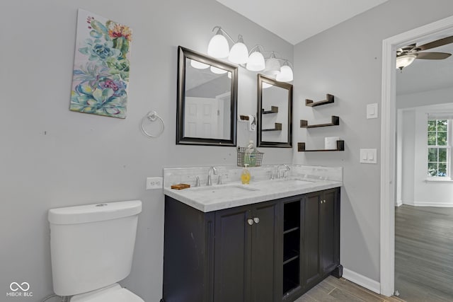 8850 Tanner Dr, Fishers, IN 46038 - bathroom featuring wood finished floors, double vanity, and ceiling fan